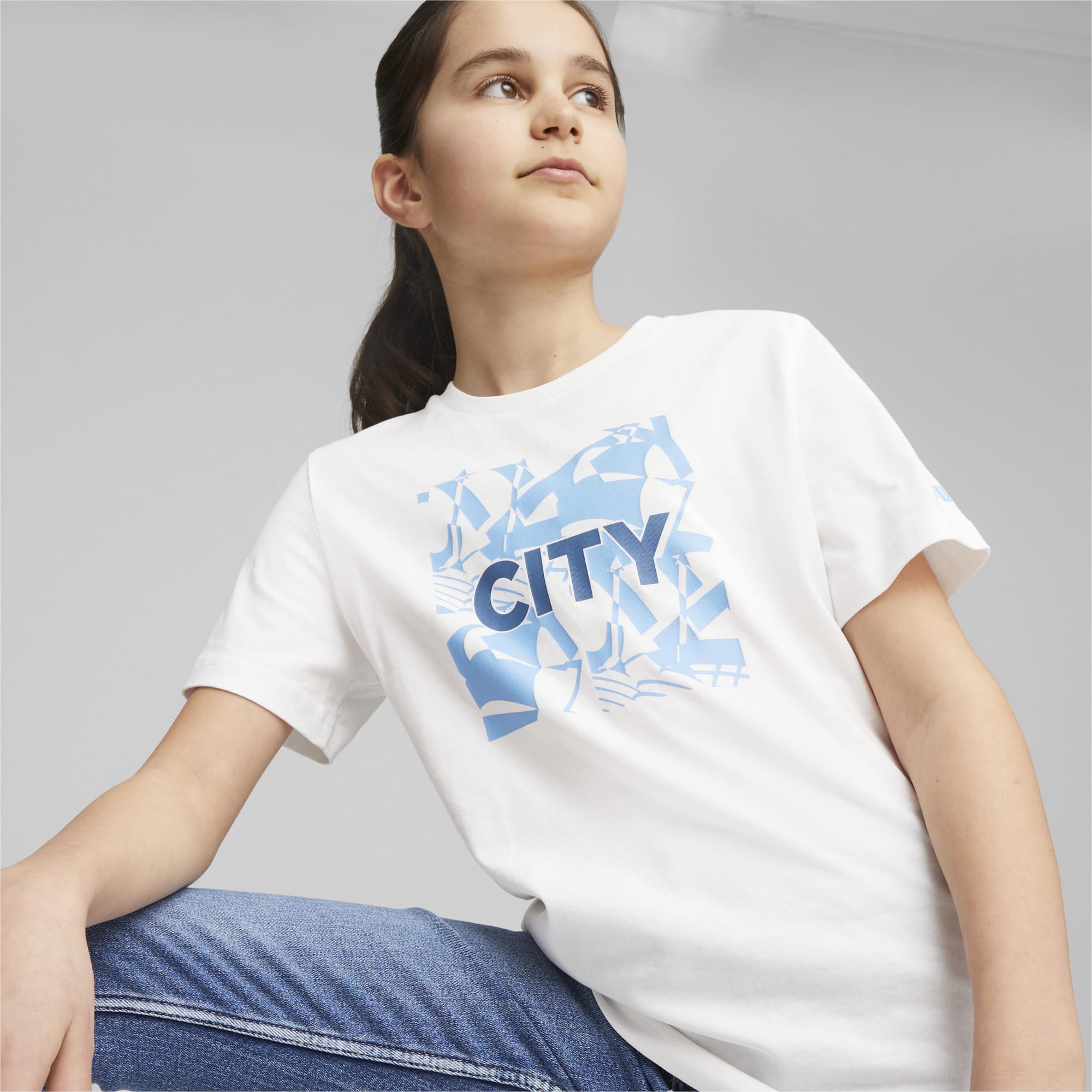 PUMA Manchester City Ftblcore Youth Graphic T-Shirt, White/Light Blue