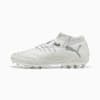 White PUMA football boot with silver logo and textured upper.