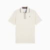 Polo PUMA da uomo color crema con maniche corte, finiture marroni e piccolo logo.