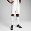 On grey, a model wears a white kit, socks and black football boots in a standing position.
