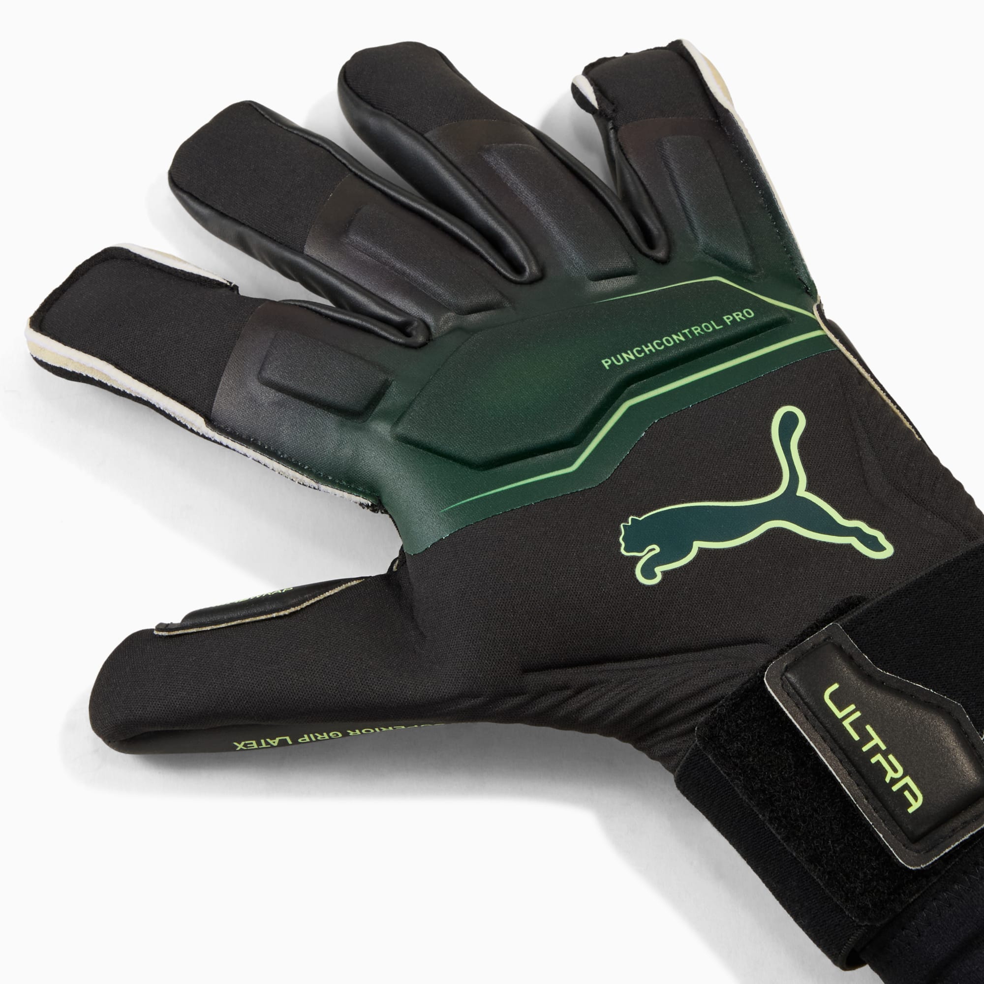 Gant de gardien de but PUMA noir avec détails verts et une dragonne.