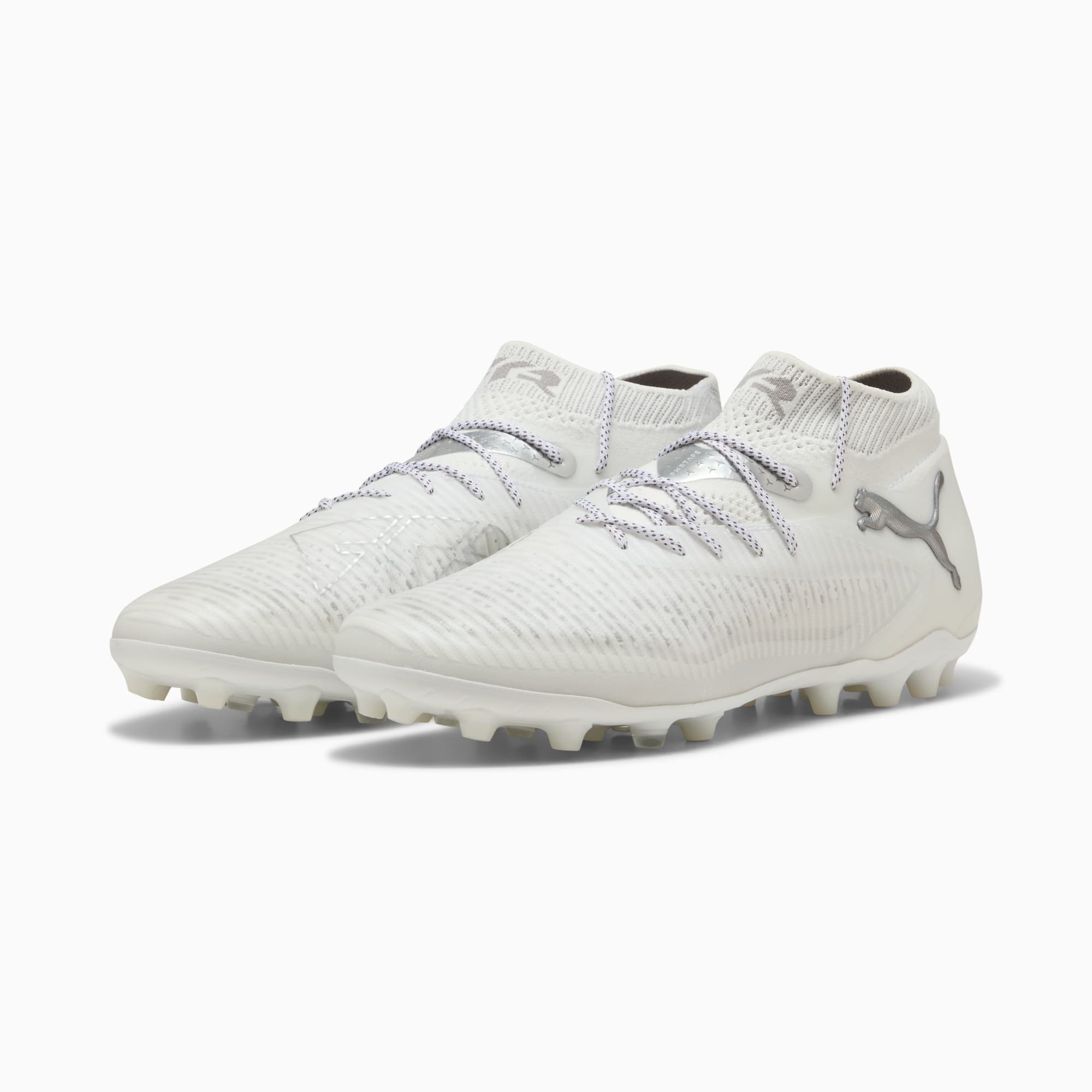 White PUMA football boots for adults, with laces and a silver logo on the side.