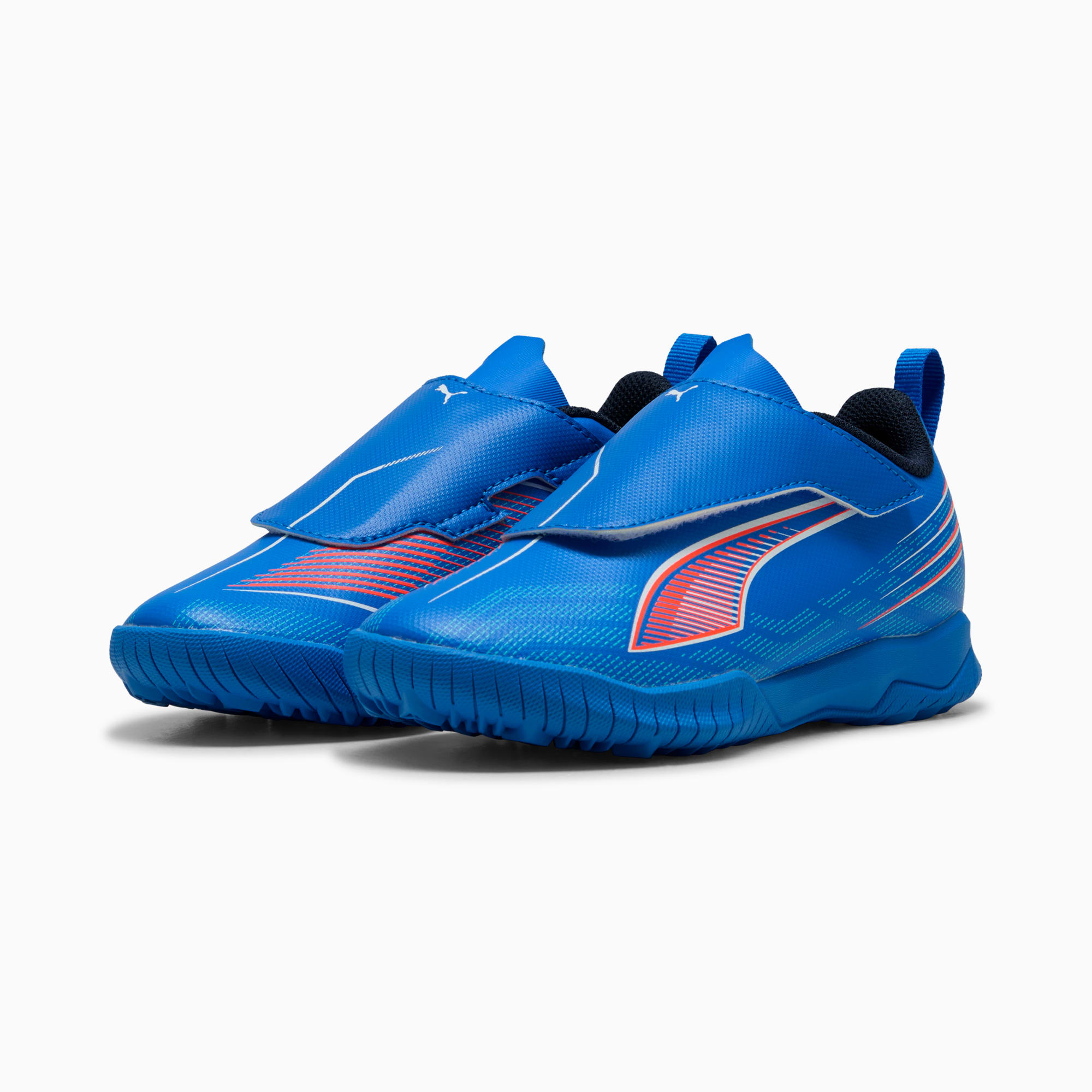Scarpe da ginnastica blu PUMA per bambini con chiusura a strappo e dettagli arancioni.