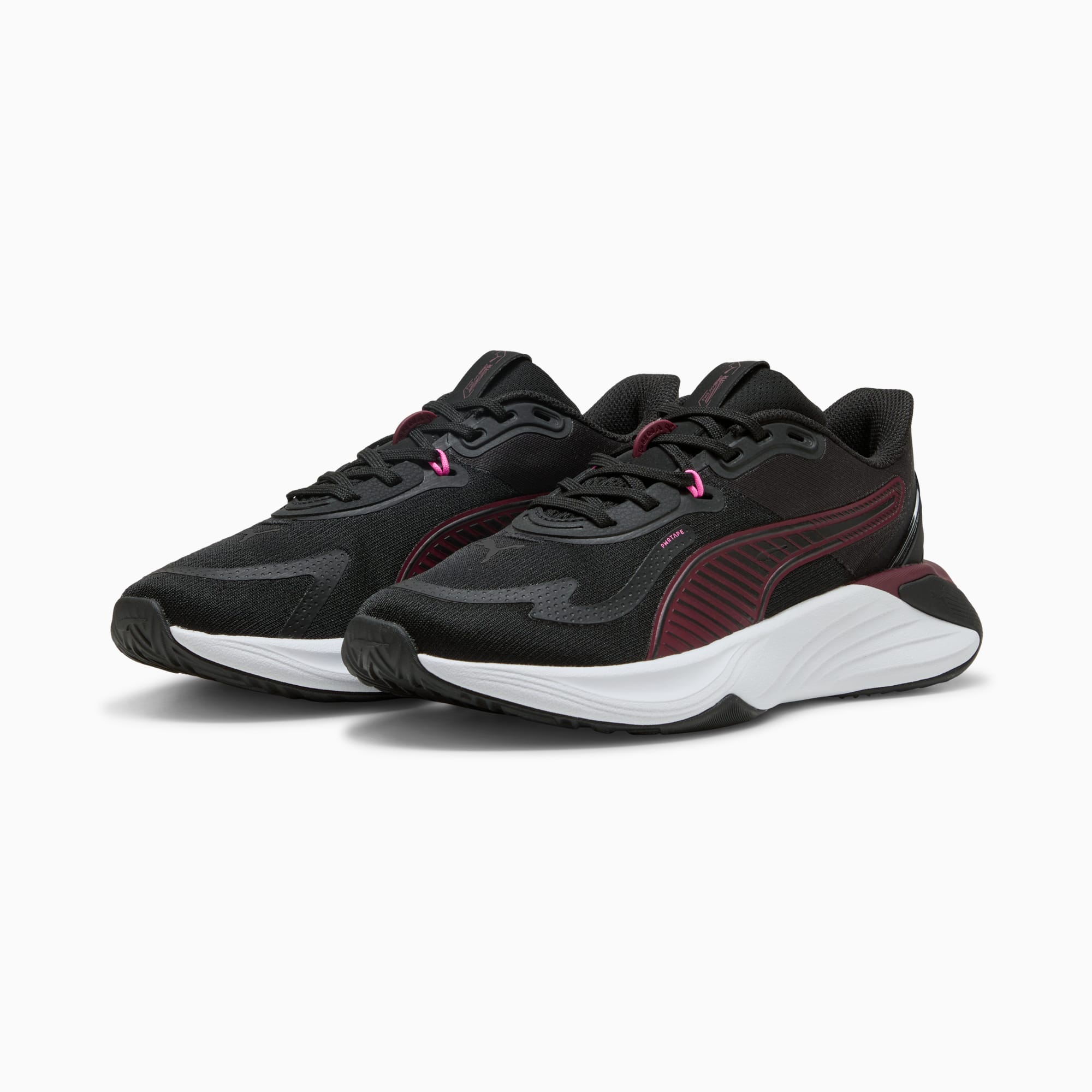 Black PUMA trainers with burgundy stripes and a white sole for adults.