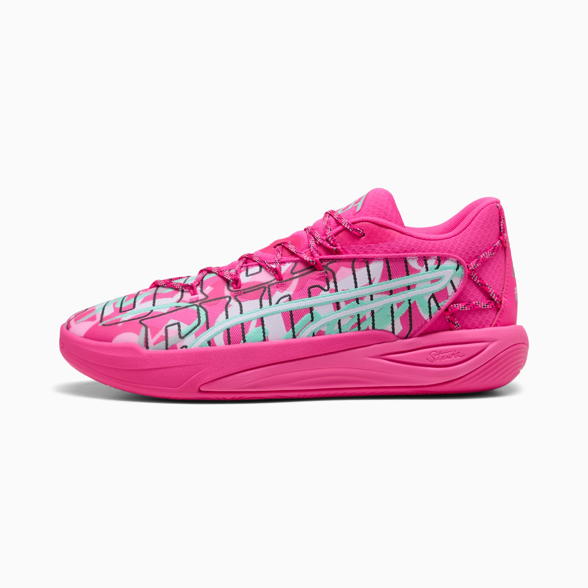 Roze PUMA sneakers met een patroon bovenwerk en vetersluiting.