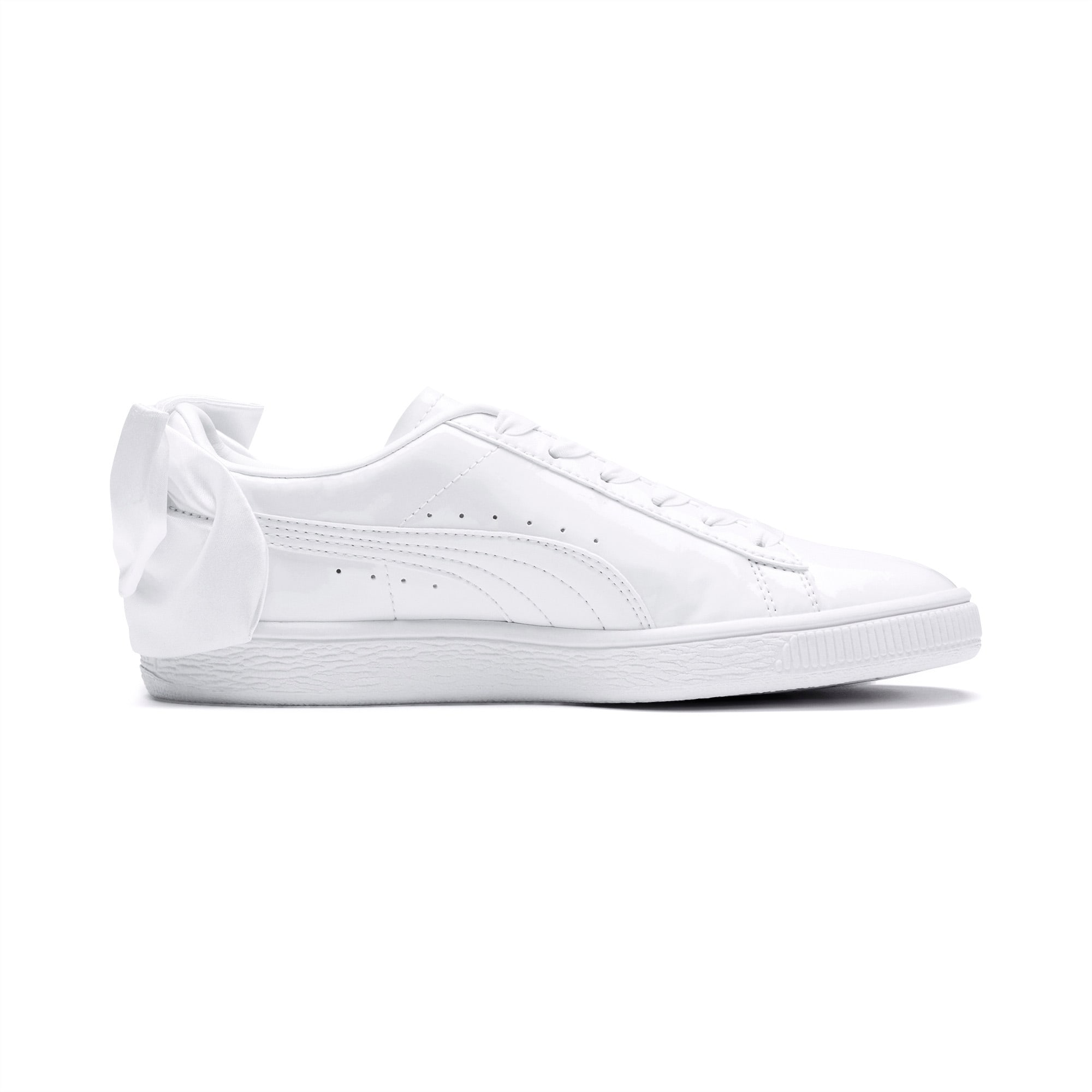 white puma trainers with bow