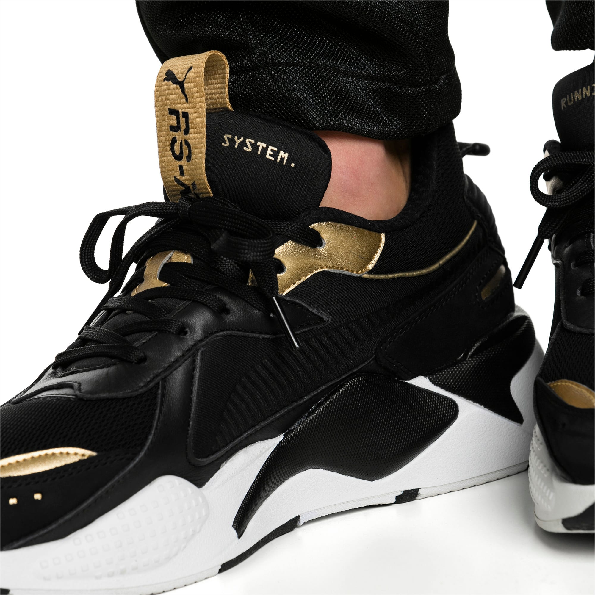 puma rsx trophy black gold