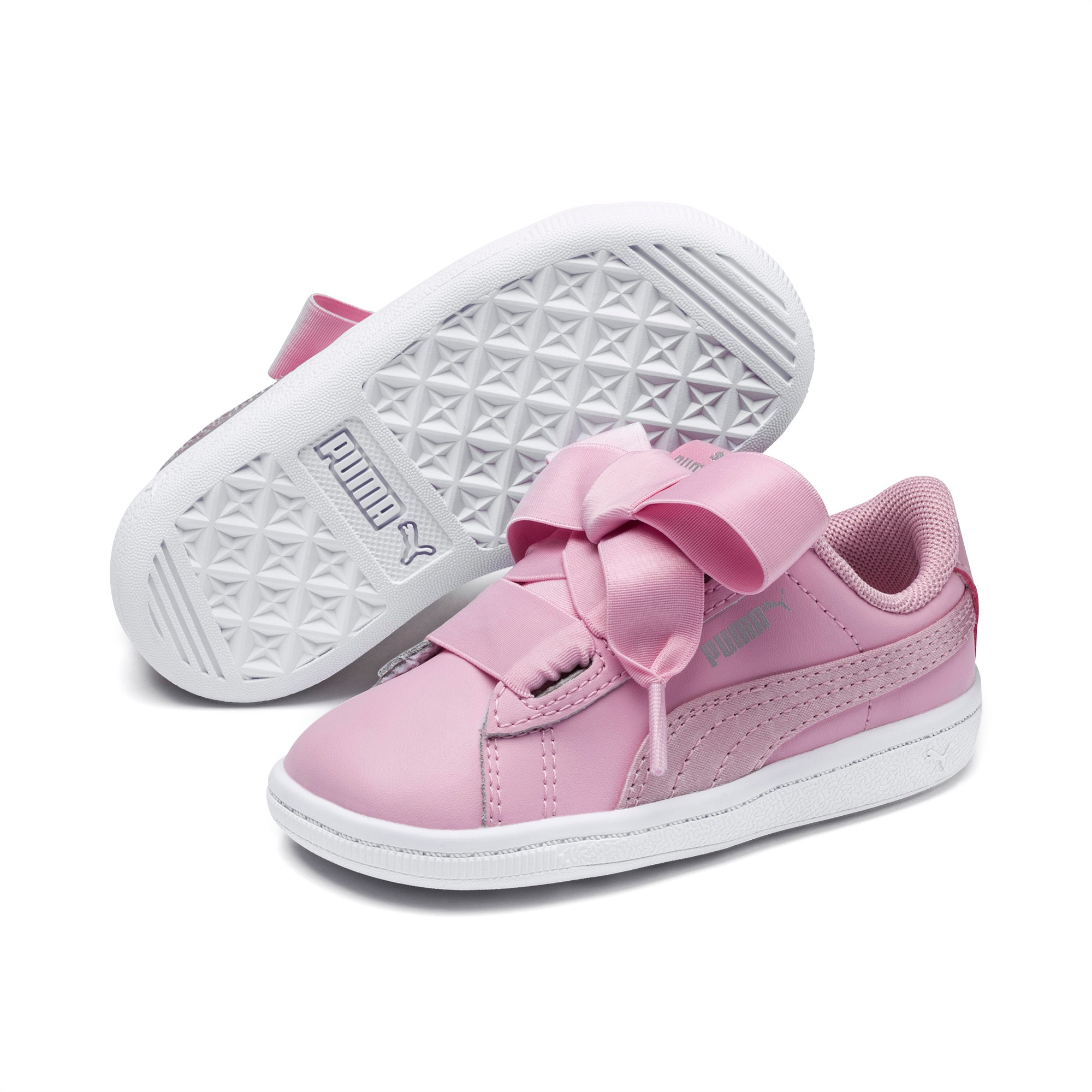 pink pumas with ribbon