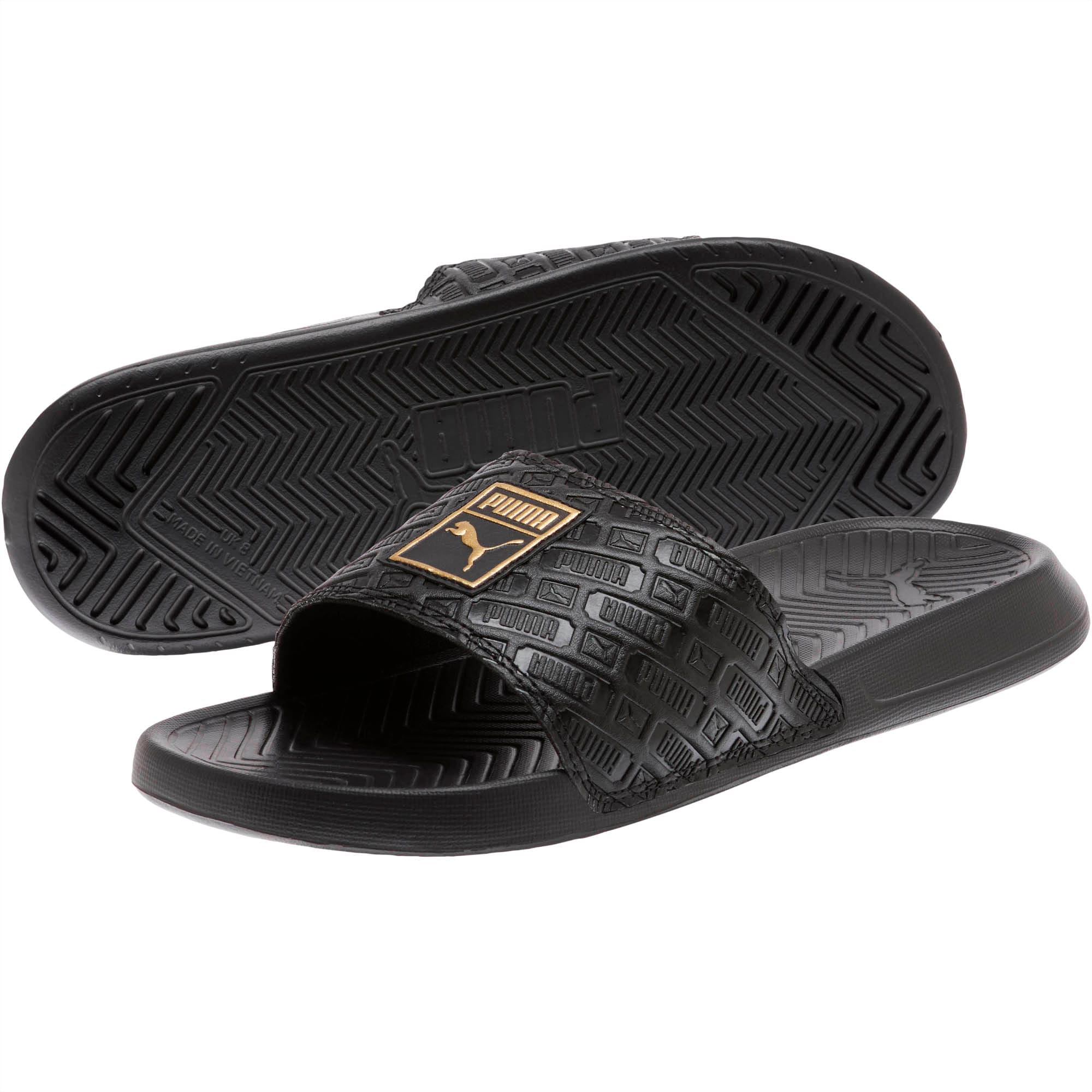 puma slides black and gold