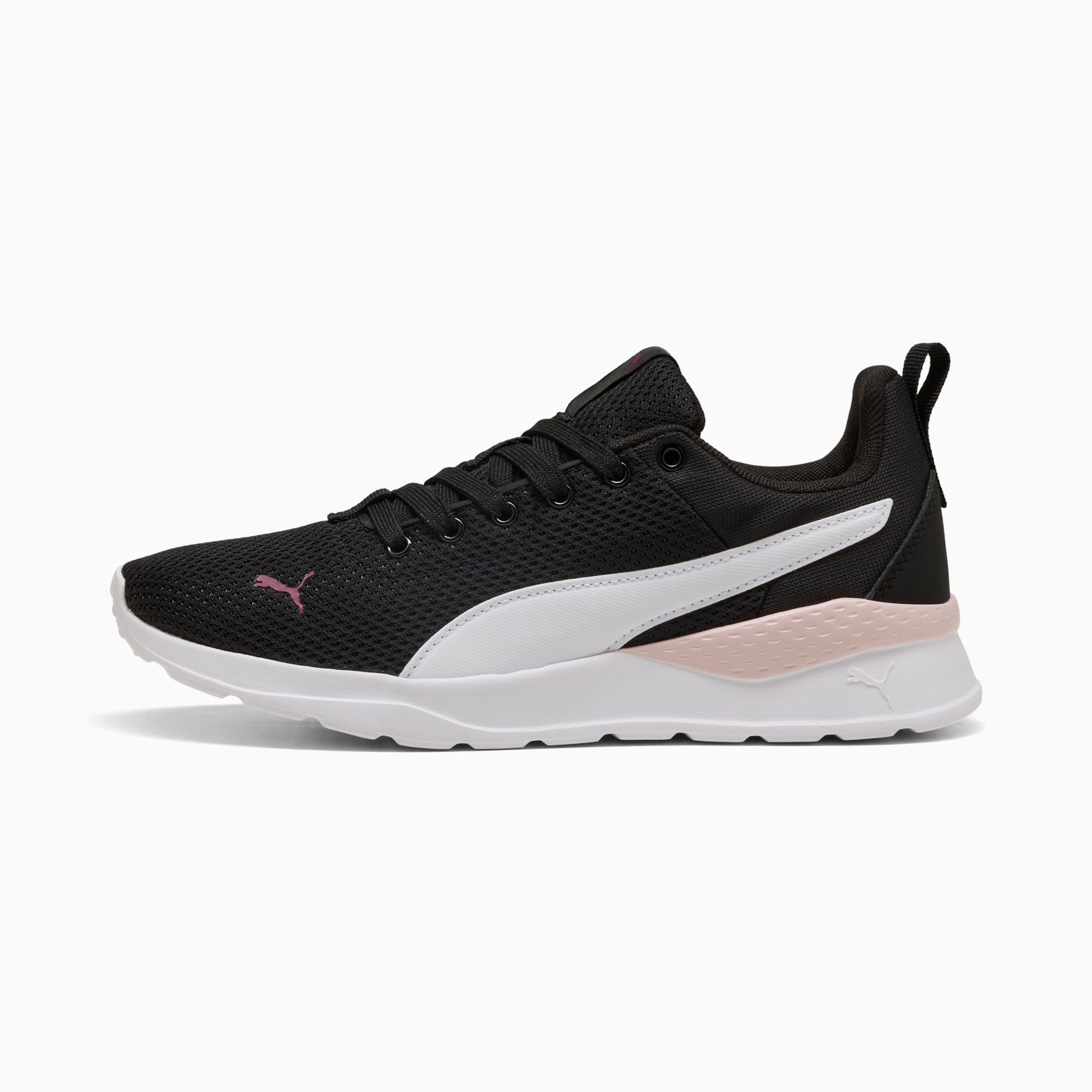 Black PUMA trainer, women's, with white formstrip and pink accent on the heel.