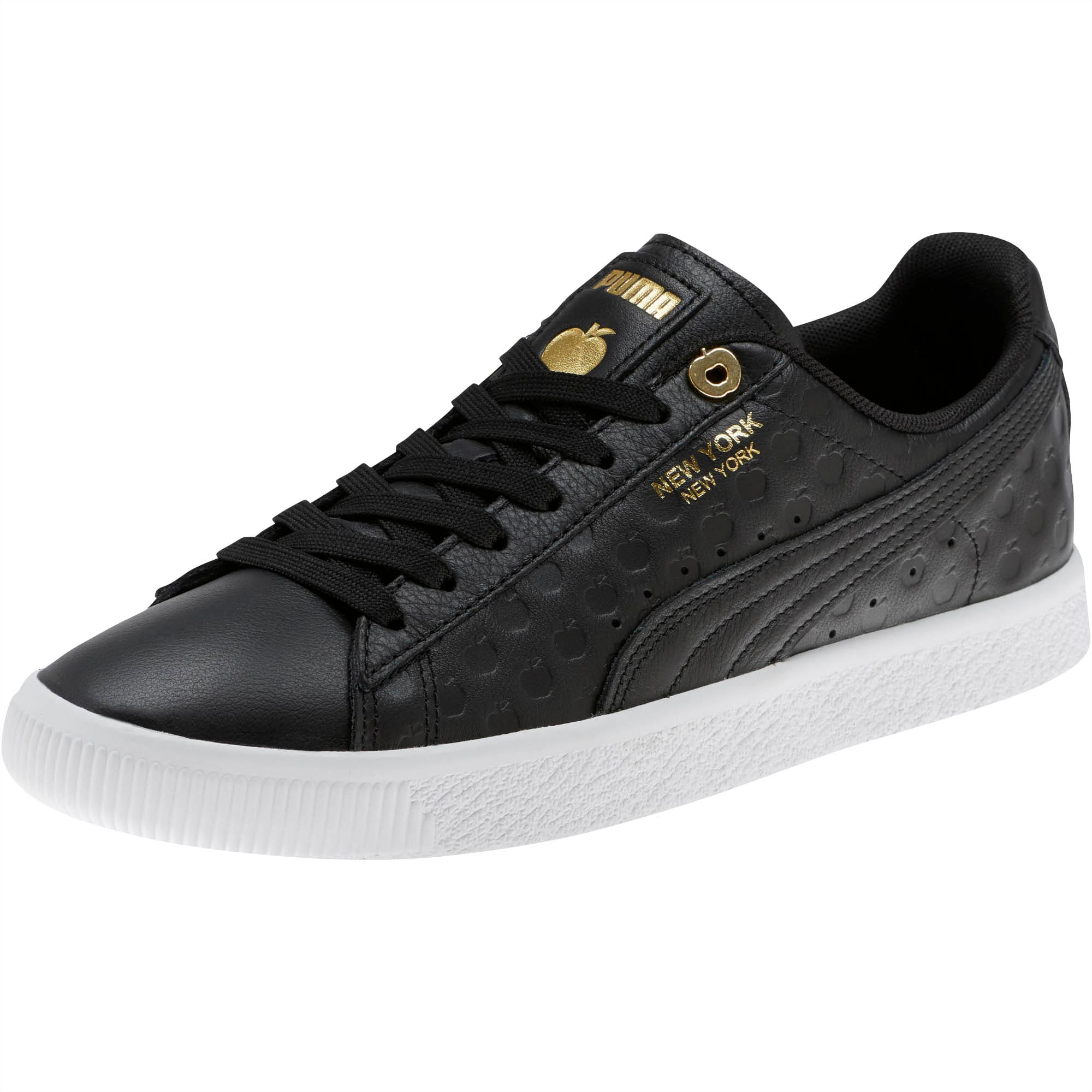 gold and black puma sneakers