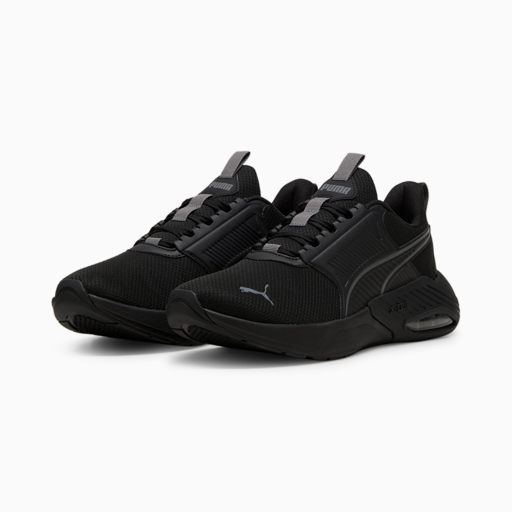 Scarpe da ginnastica PUMA nere per adulti, con tomaia in mesh e chiusura con lacci.