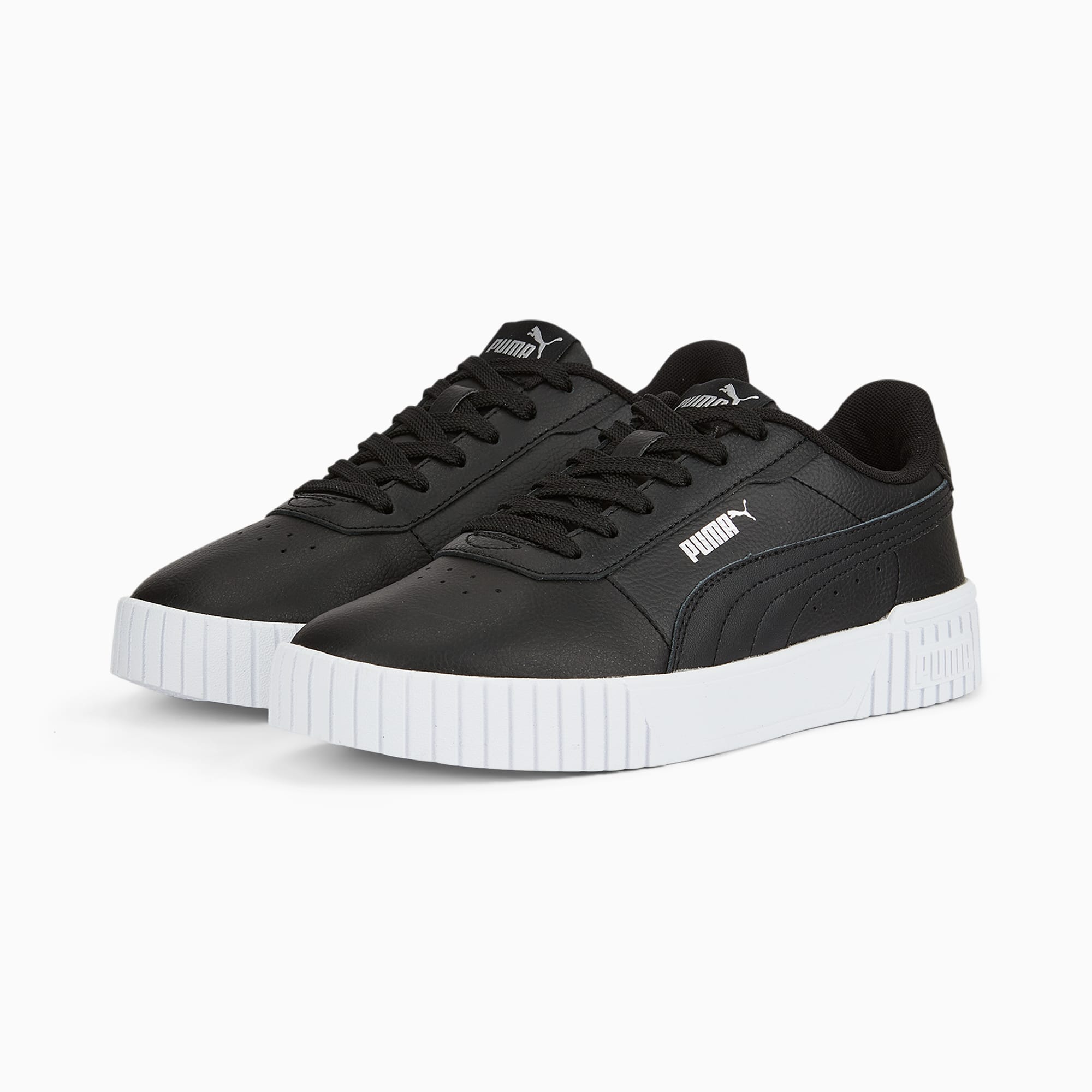 Black PUMA trainers for adults with lace-up closure and white ridged sole.