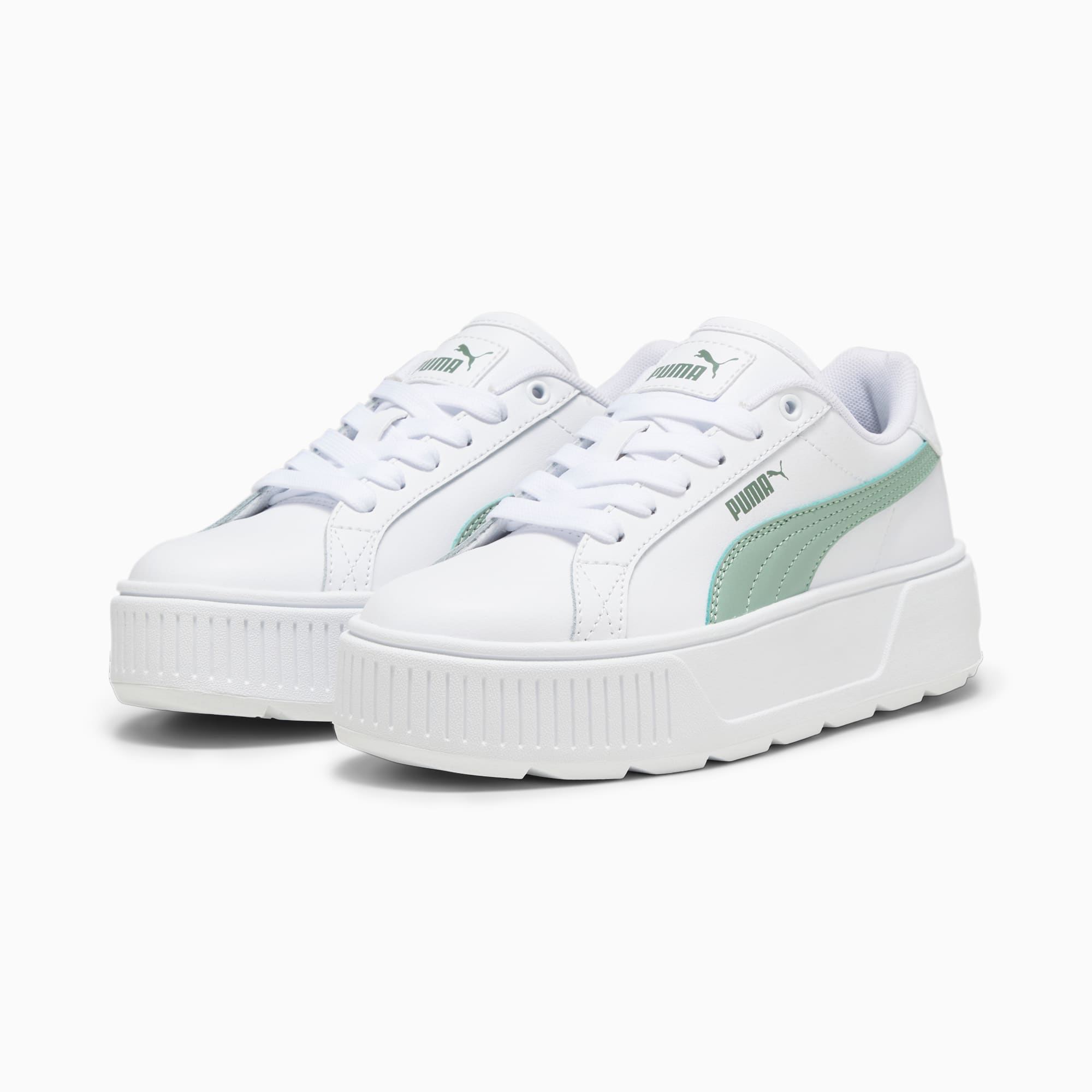 Witte PUMA sneakers voor volwassenen met verhoogde zool en mintgroene streep.