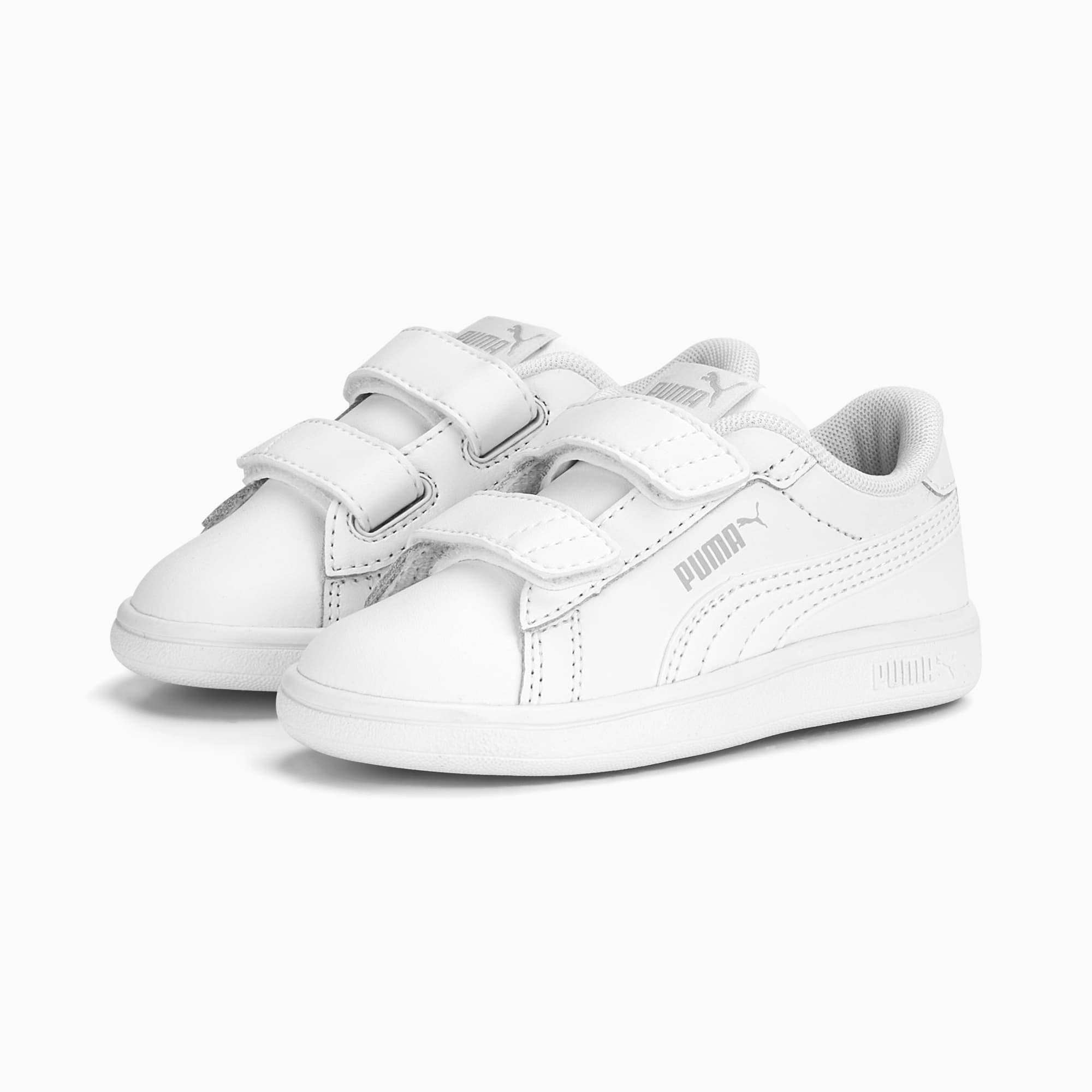 White PUMA trainers for children with touch-fastening straps and logo detail.
