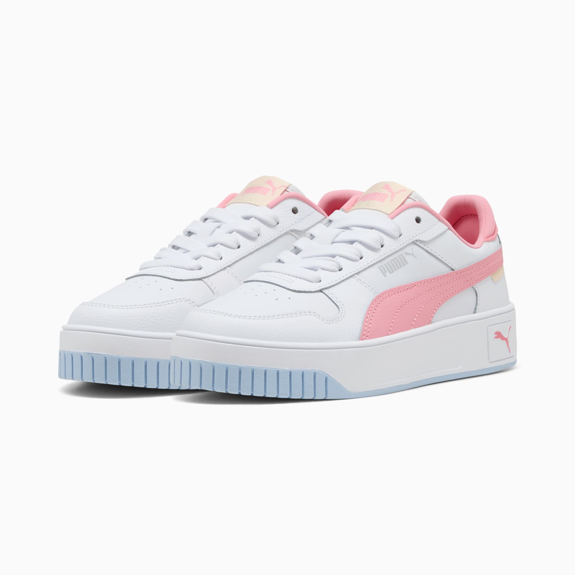Sneakers bianche PUMA da donna con dettagli rosa e suola azzurra.