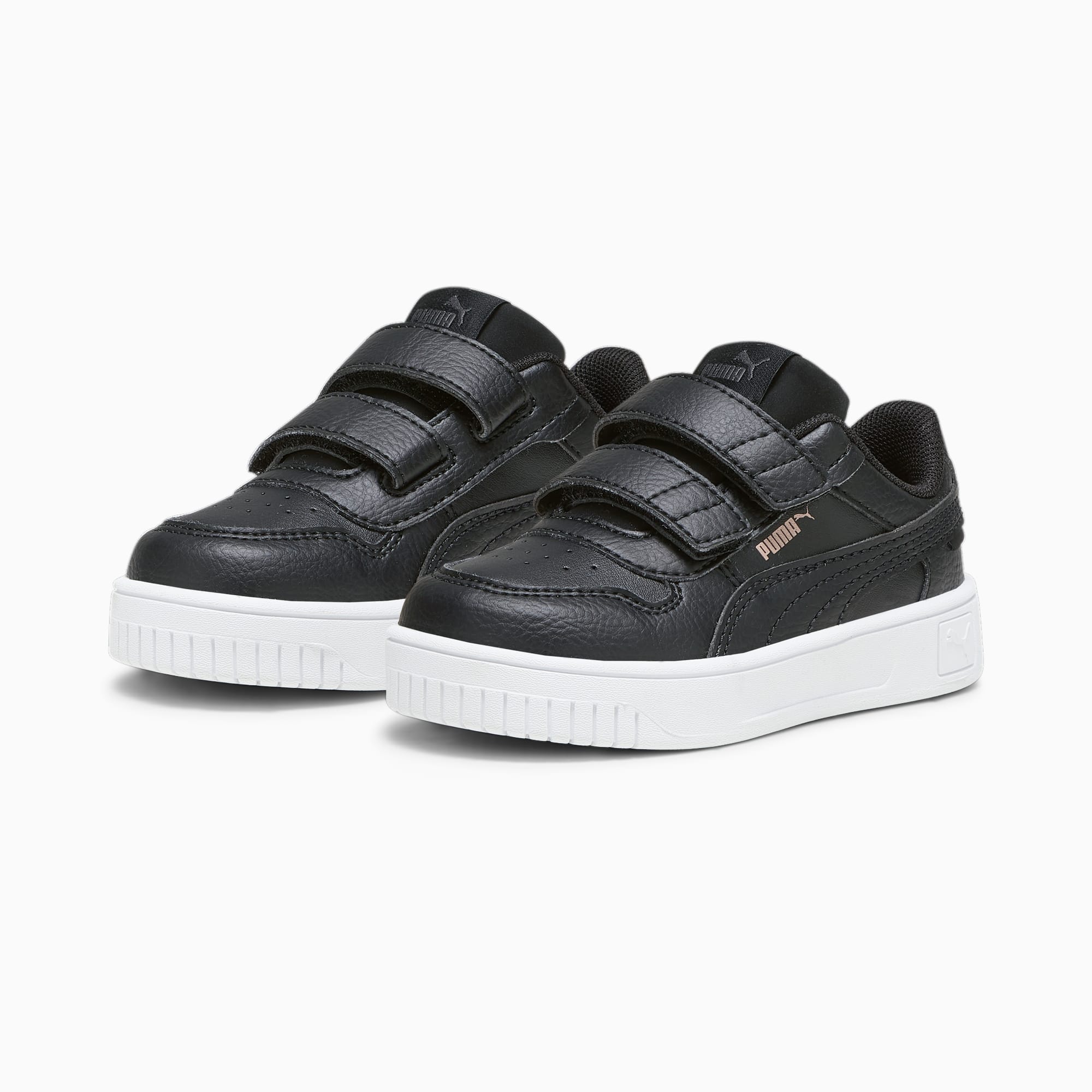 Baskets noires PUMA pour enfants, avec double fermeture à bride et semelle blanche.