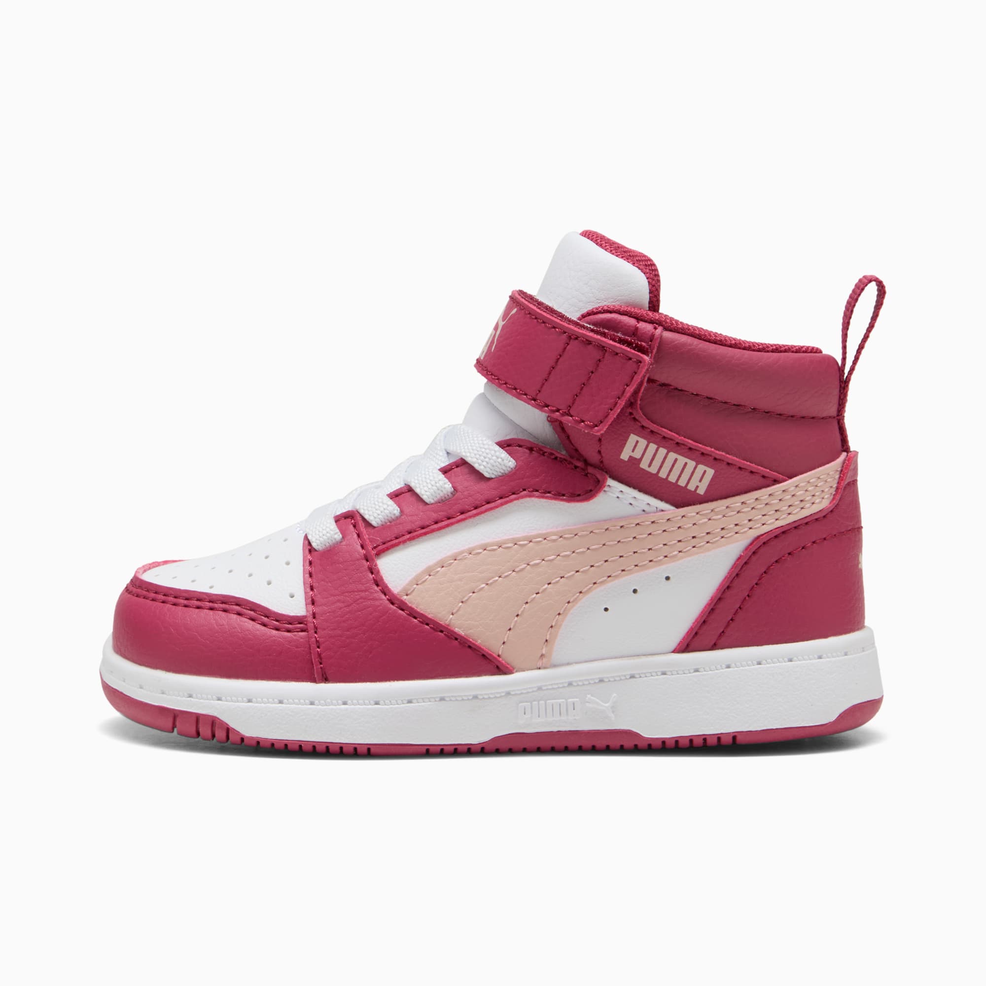 Roze PUMA peutersneaker met klittenbandsluiting en witte zool.