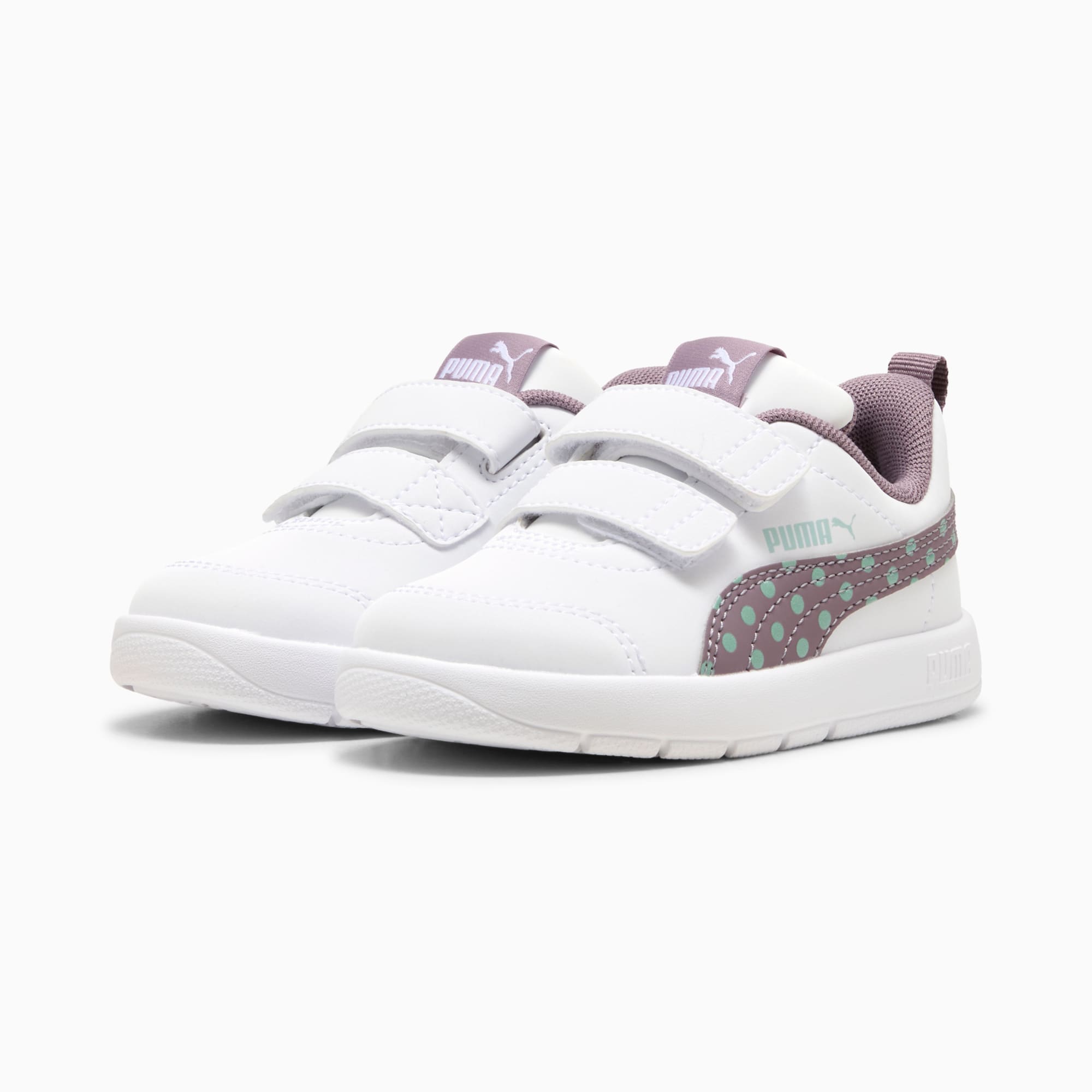 Baskets blanches PUMA pour enfant avec des brides à scratch et motif à pois.