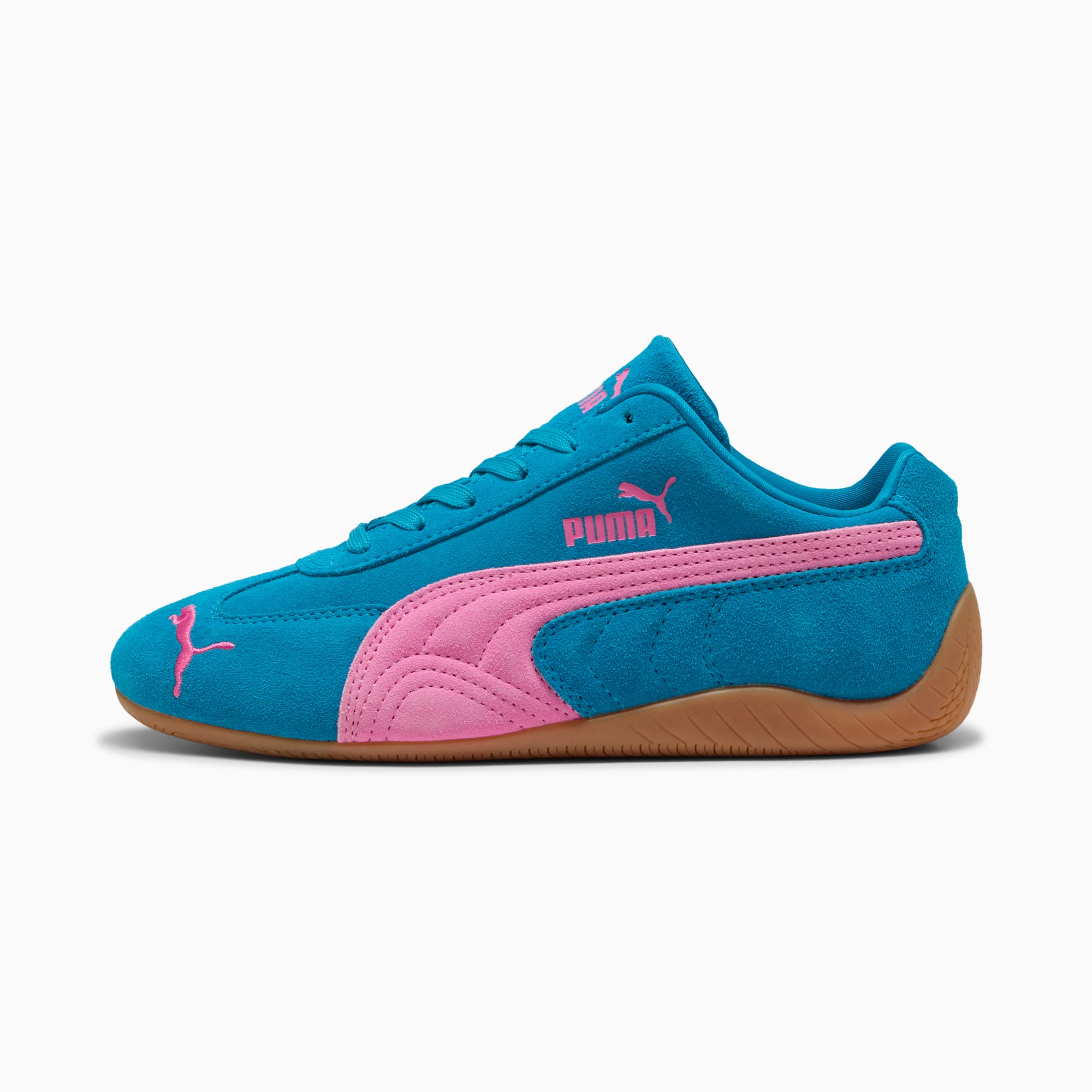 Türkiser PUMA Unisex Schuh mit pinkem Formstreifen und Sohlendetails.