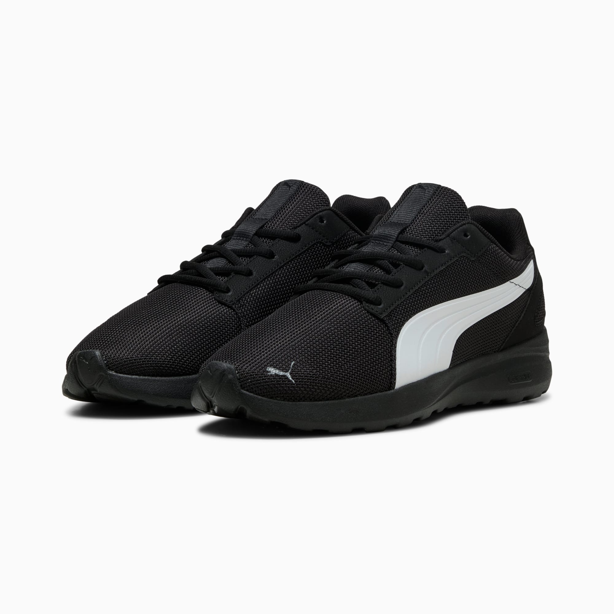 Baskets PUMA noires, pour adultes, avec bande blanche et fermeture à lacets.
