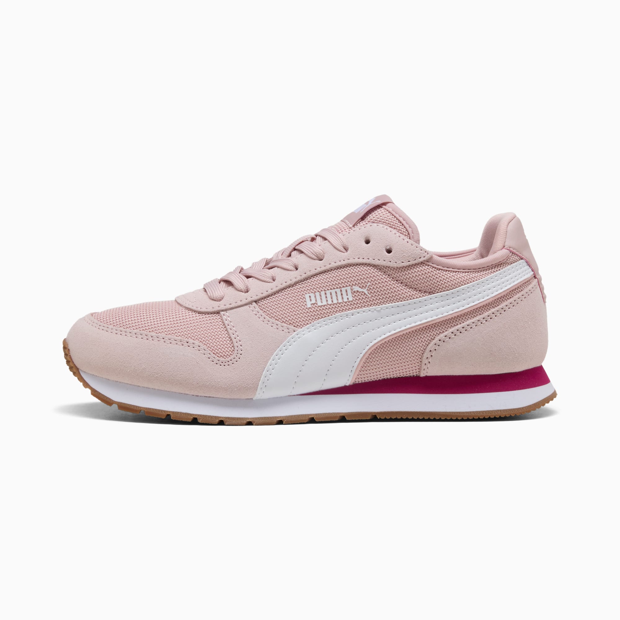 Baskets PUMA roses pour femmes avec une bande latérale blanche et une semelle couleur gomme.