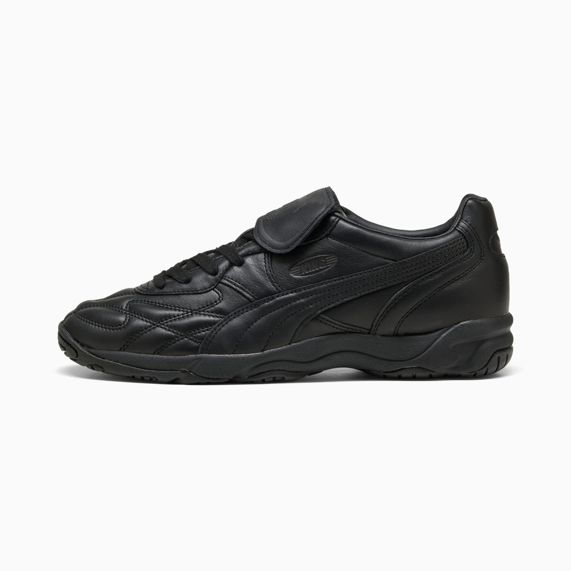 Chaussure d'entraînement noire PUMA homme avec fermeture à lacets et bride agrippante.