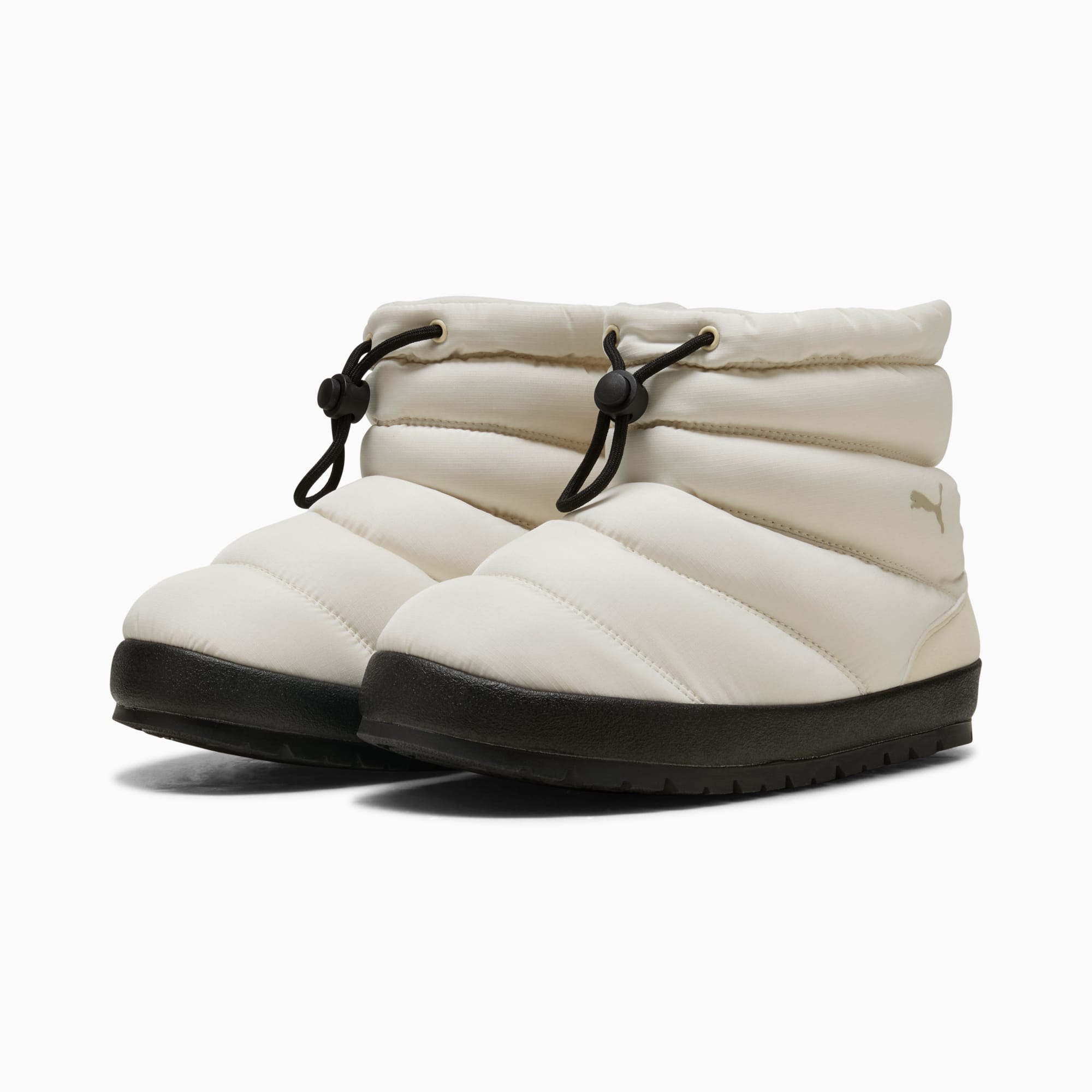White PUMA slipper boot with a quilted design and black sole.