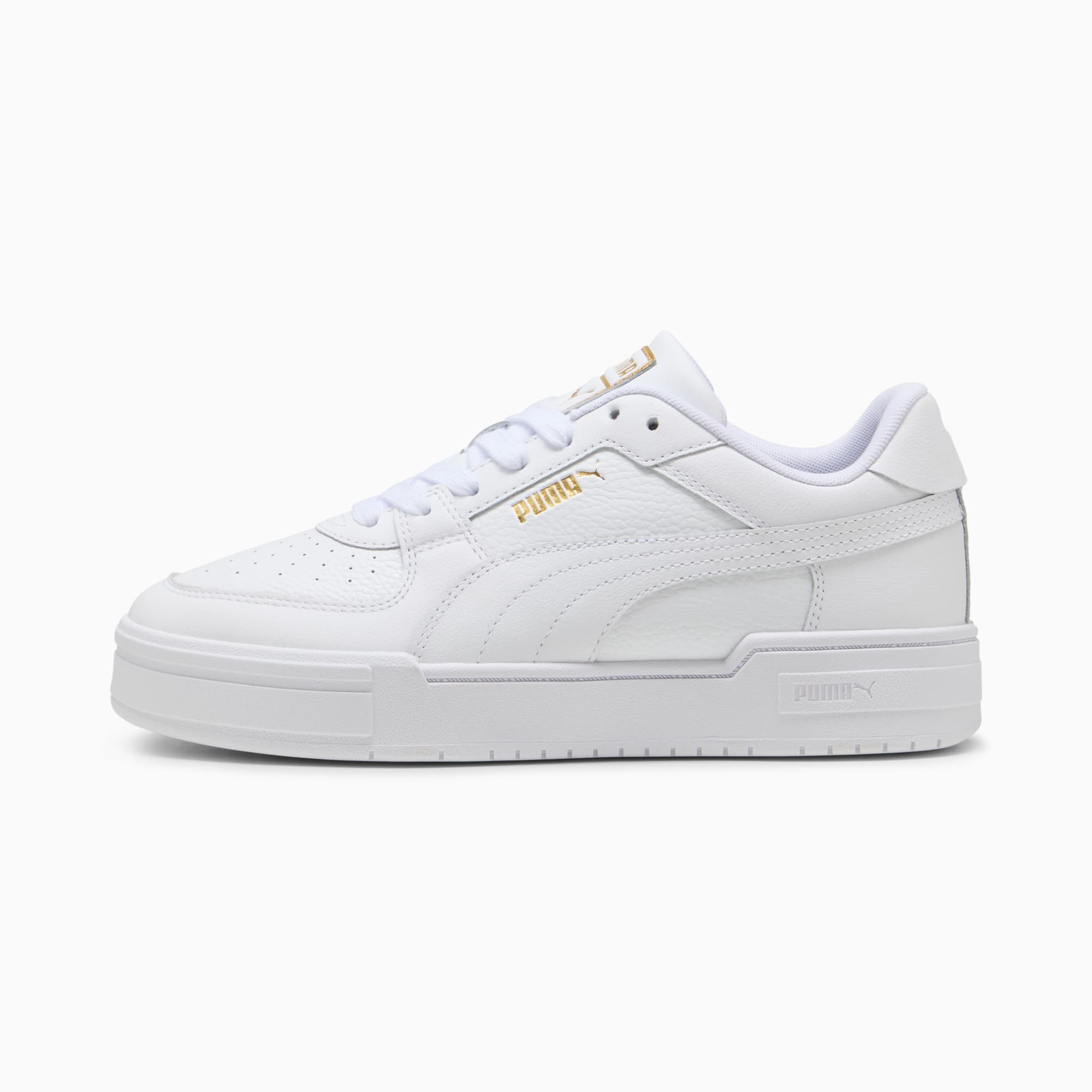 White PUMA trainers for adults with gold logo and lace-up fastening.