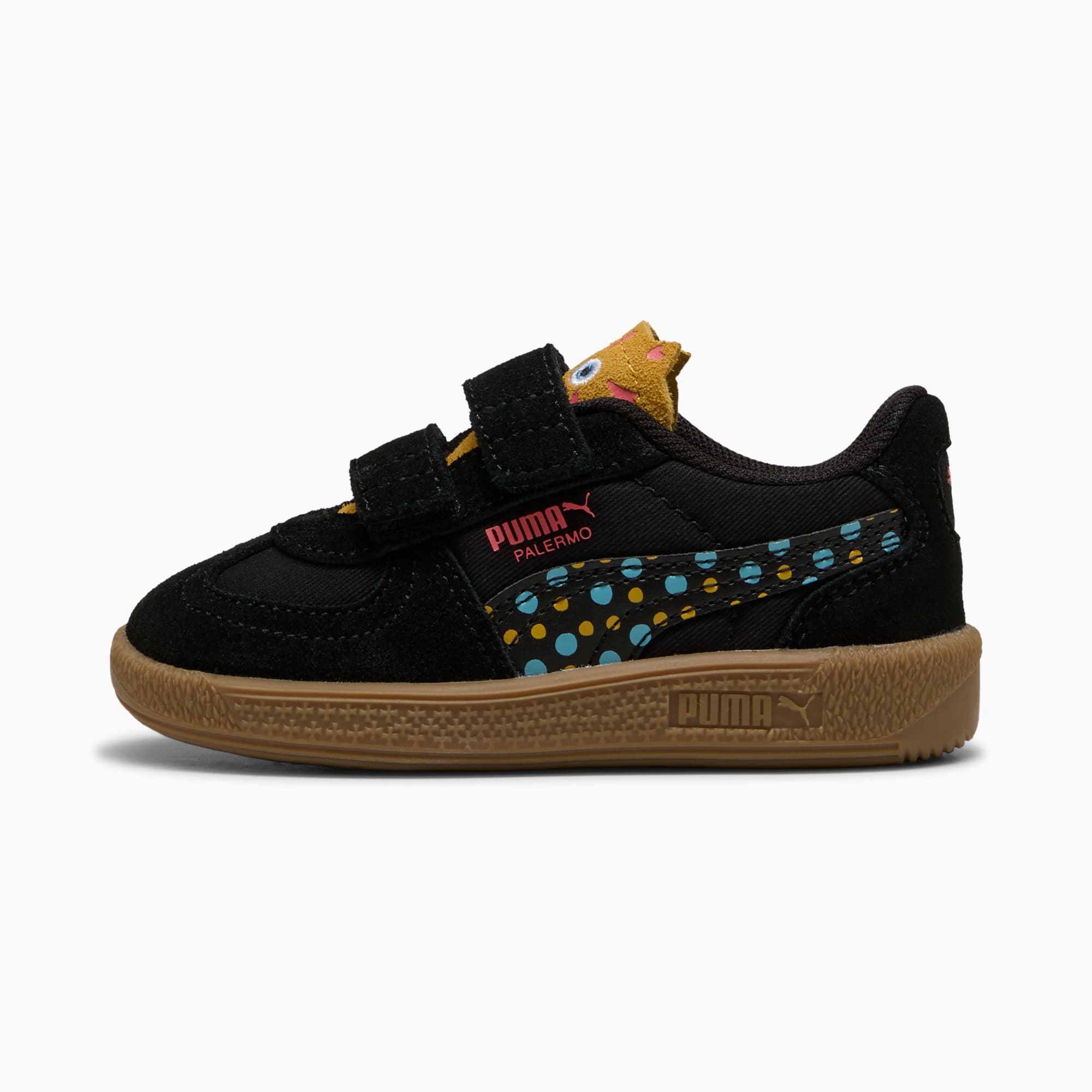 Baskets noires PUMA pour bébés, à brides auto-agrippantes et pois colorés.
