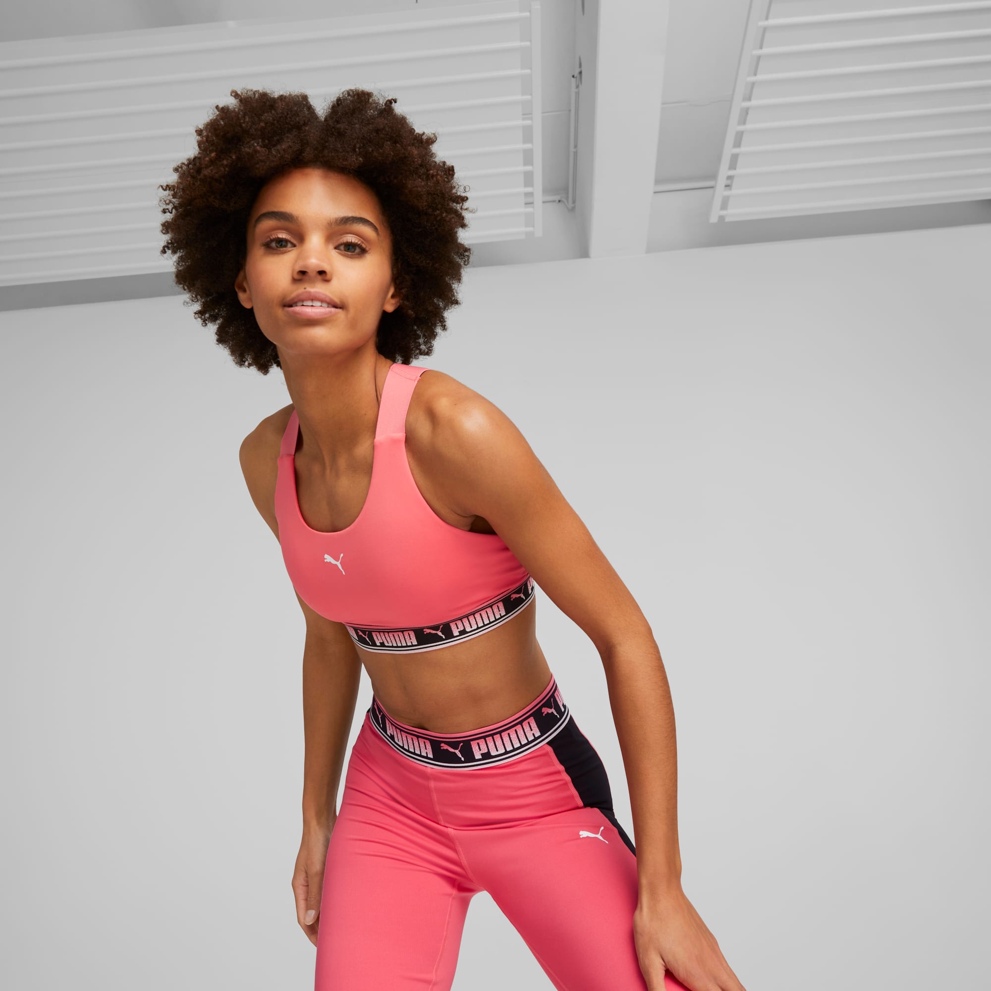 PUMA Sports bra FIT MID IMPACT in neon pink