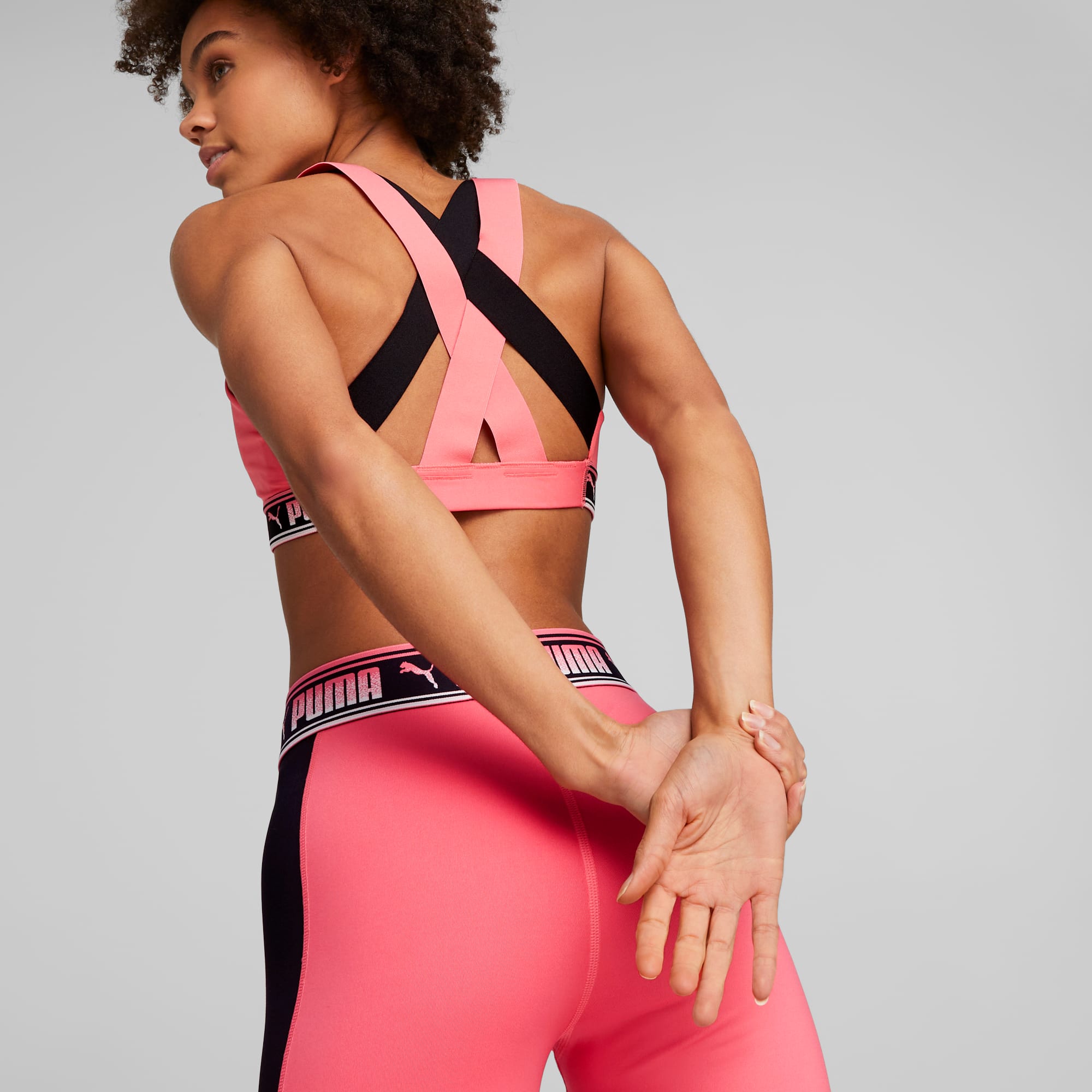 PUMA Sports bra FIT MID IMPACT in neon pink