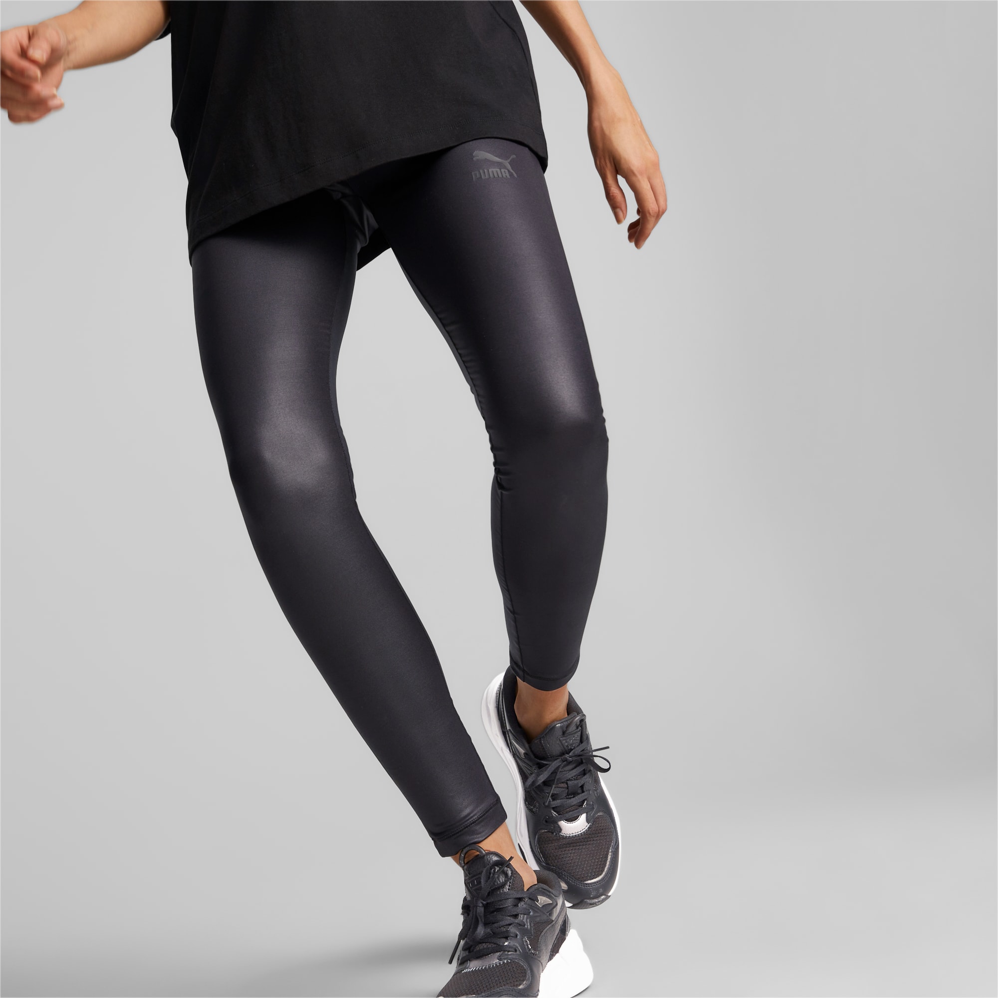 Jogger wearing leggings made from shiny spandex, Stretching