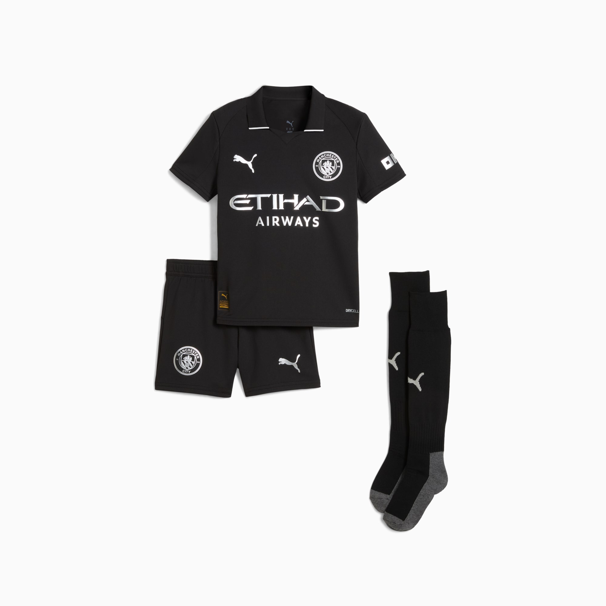 Kit PUMA noir (enfant) avec maillot, short et chaussettes arborant logos sponsor et équipe.