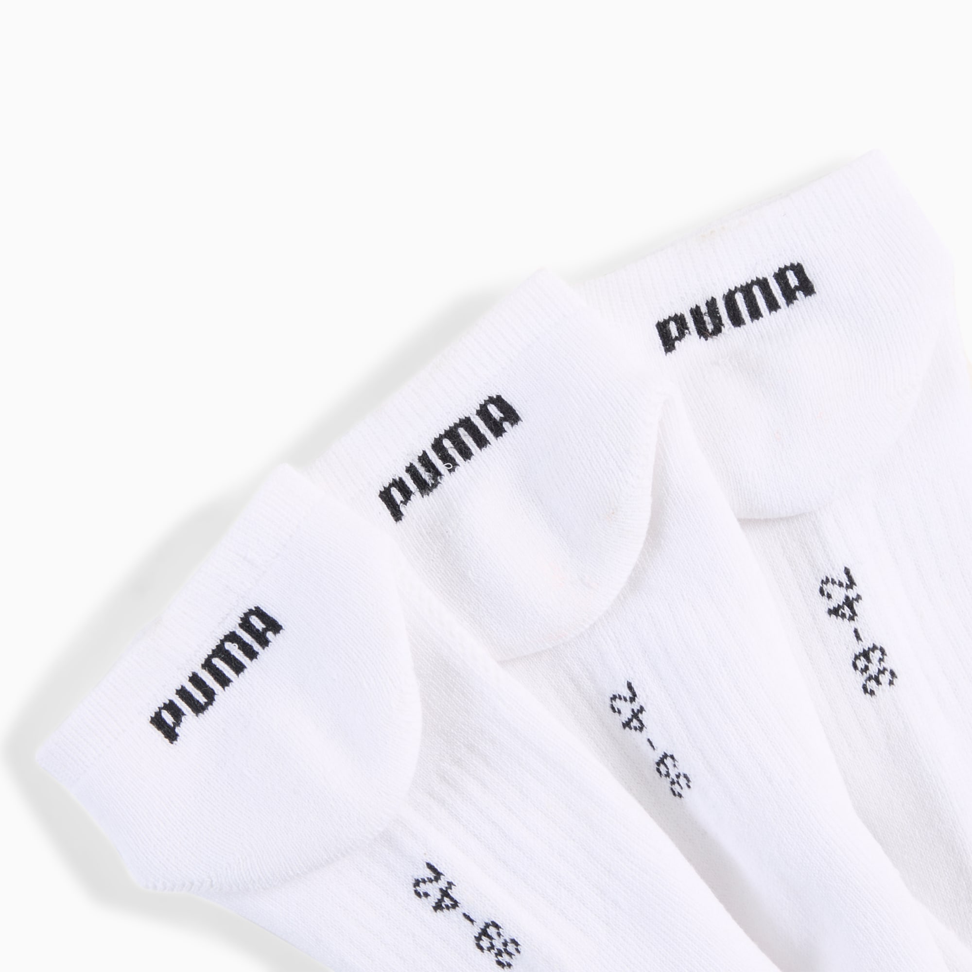 Weisse PUMA Socken für Erwachsene mit schwarzem Logo und Größenangabe.