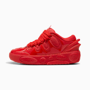 Red PUMA trainers with a glossy finish and embossed text on the sole.