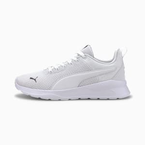White PUMA trainers, women's, with mesh upper and synthetic overlays.