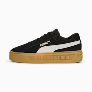 Black PUMA women's trainer with a white stripe and a thick gum-coloured sole.