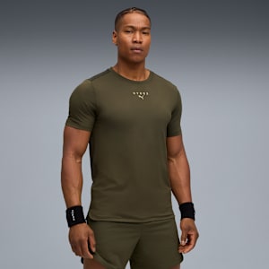 A model poses against a grey backdrop, wearing an olive t-shirt and matching shorts.