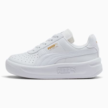 gold and white puma sneakers