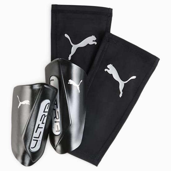 Black PUMA shin guards with sleeves, featuring a white logo and 'ULTRA' text.