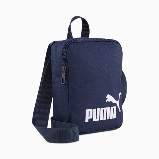 Navy PUMA Reporter Bag with a zip closure and adjustable shoulder strap.