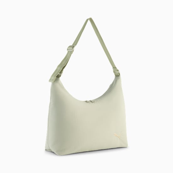 Green PUMA shoulder bag with an adjustable strap and subtle logo detail.