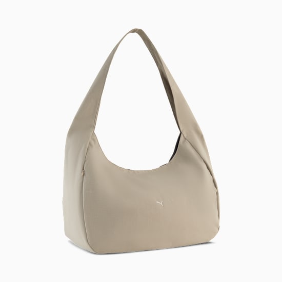 Beige PUMA hobo bag with a single shoulder strap and subtle logo detail.