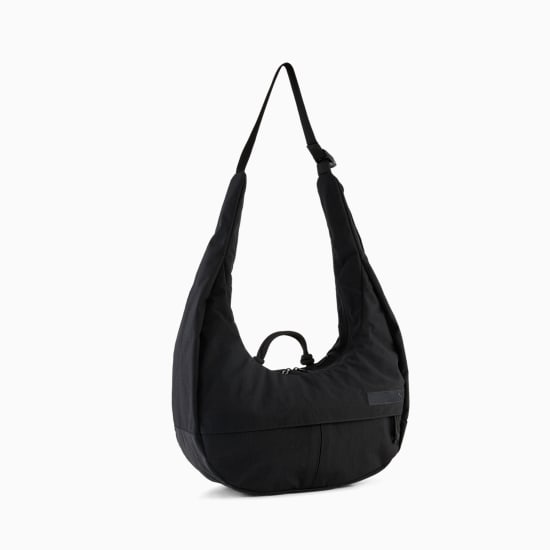 Black PUMA shoulder bag with adjustable strap and front pocket detail.
