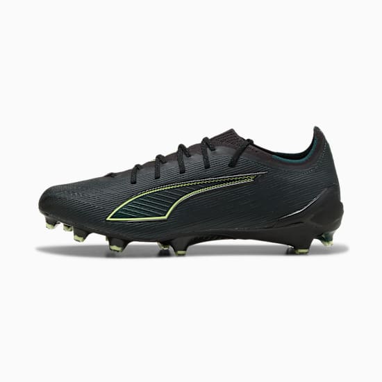Black PUMA adult football boot with neon green logo and cleated sole.