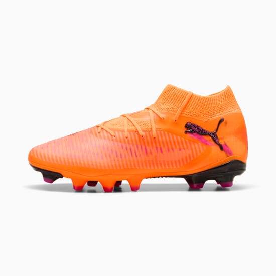 Orange PUMA football boot with a high collar and patterned upper.