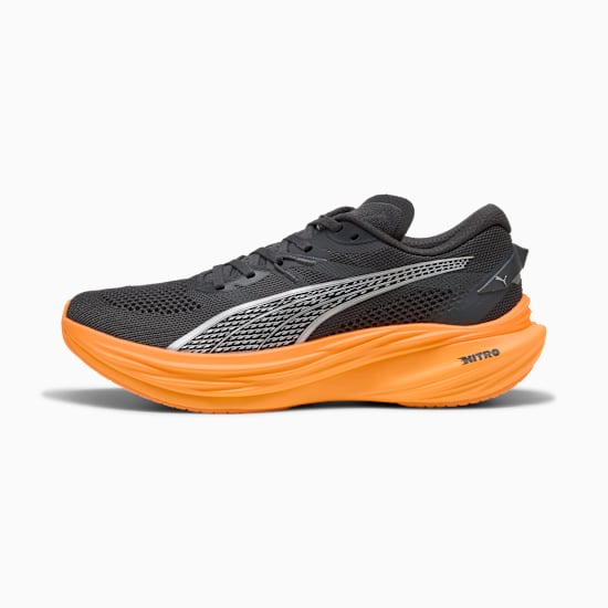 Dark grey PUMA running shoe with orange sole and silver formstrip for adults.