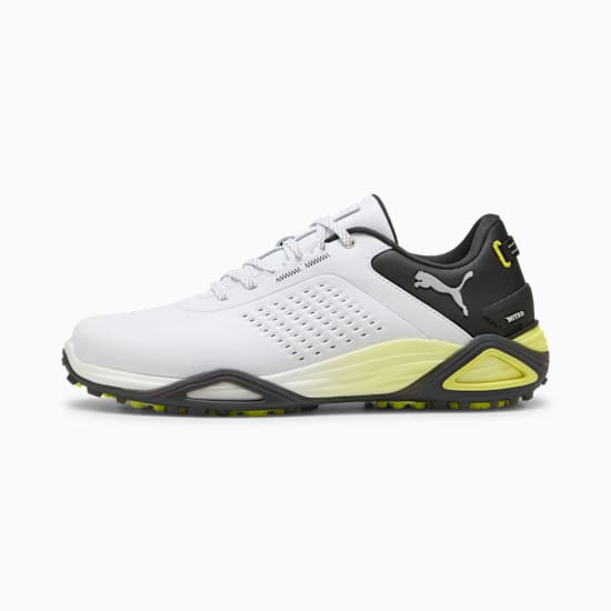 White PUMA men's golf shoe with a perforated design and black and yellow accents.