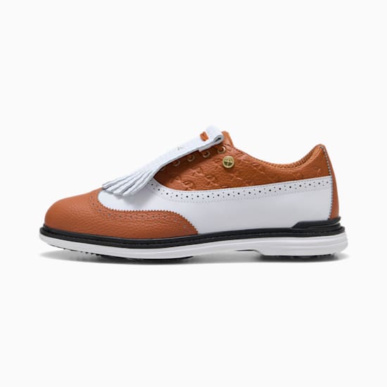 Brown PUMA golf shoe featuring white accents and decorative fringing for adults.